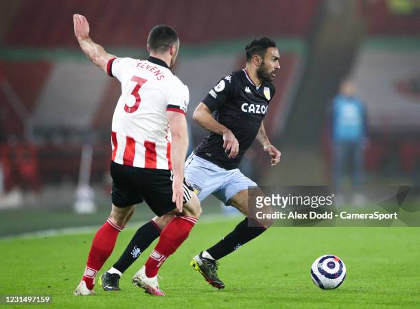 Aston Villa's Ahmed Elmohamady gets away from Sheffield United's Enda Stevens during the Premier League match between Sheffield United and Aston...