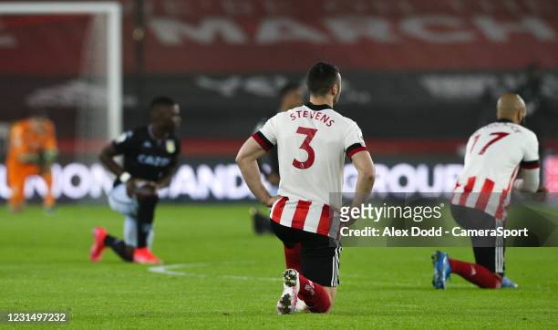 Players take the knee before the Premier League match between Sheffield United and Aston Villa at Bramall Lane on March 3, 2021 in Sheffield, United...