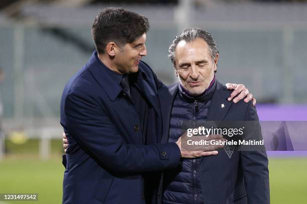 Paulo Fonseca manager of AS Roma hugs Cesare Prandelli anager of ACF Fiorentina during the Serie A match between ACF Fiorentina and AS Roma at Stadio...