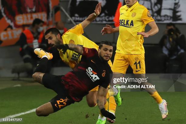 Galatasaray's US defender Deandre Yedlin is challenged Ankaragucu's Turkish midfielder Alper Potuk during the Turkish Super Lig week 28 football...