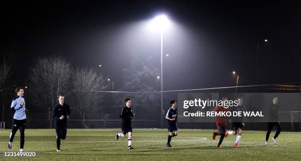 Footballers of the FC Purmerend attend a training session as the age required for outdoor sports in a team has been leveled up to 27 years, in...