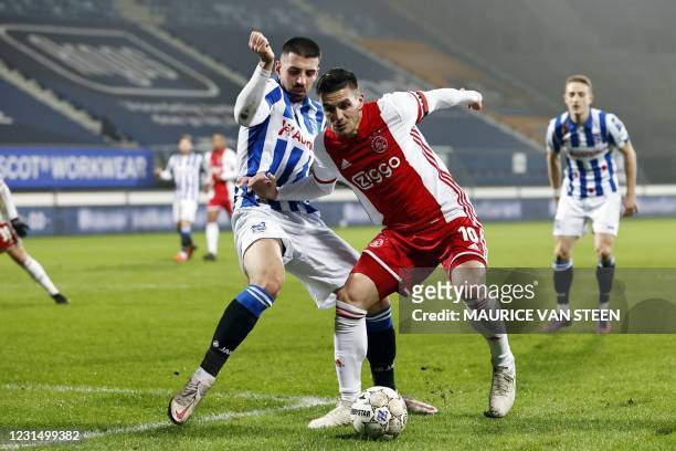 Ibrahim Dresevic of sc Heerenveen fights for the ball with Dusan Tadic or Ajax during the KNVB Cup semi-final match between sc Heerenveen and Ajax...