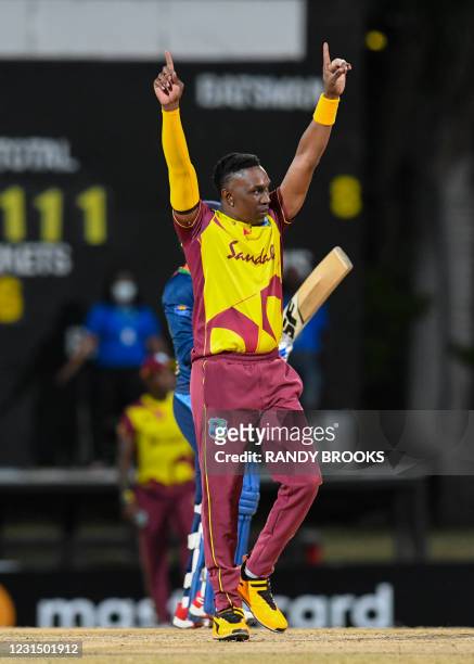 Dwayne Bravo of West Indies celebrates the dismissal of Wanindu Hasaranga of Sri Lanka during a T20i match between Sri Lanka and West Indies at...