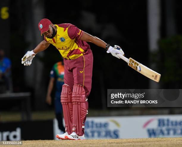 Kieron Pollard of West Indies celebrates hitting 6 sixes off Akila Dananjaya of Sri Lanka during a T20i match between Sri Lanka and West Indies at...