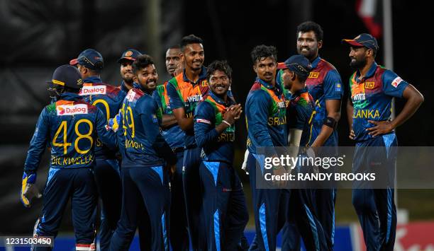 Wanindu Hasaranga , Dushmantha Chameera , Akila Dananjaya , Ashen Bandara , Thisara Perera and Nuwan Pradeep of Sri Lanka celebrate the dismissal of...