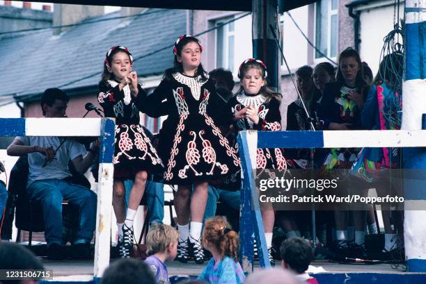 Young Irish dancers performing in costume during the Puck Fair, Killorglin, County Kerry, Ireland on 12th August 1993. Presided over by King Puck, a...