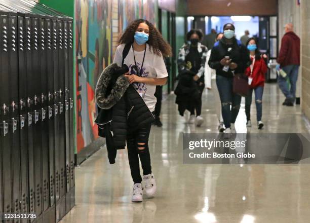 Freshman students walk the hallway in between classes during the bell break, which normally would be packed by students, at Brockton High School in...