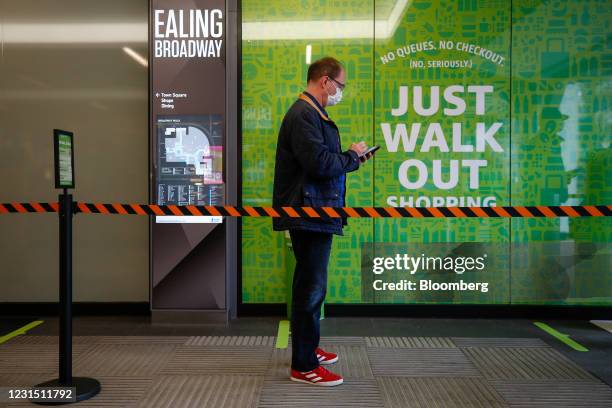 Customer queues to shop at the Amazon.com Inc. Amazon Fresh cashierless convenience store in the Ealing area of London, U.K., on Thursday, March 4,...