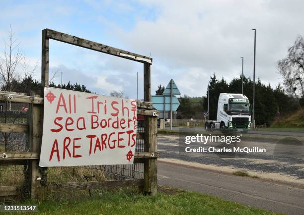 Loyalist banner threatening port staff can be seen near Larne harbour on March 4, 2021 in Larne, Northern Ireland. The Loyalist Communities Council...