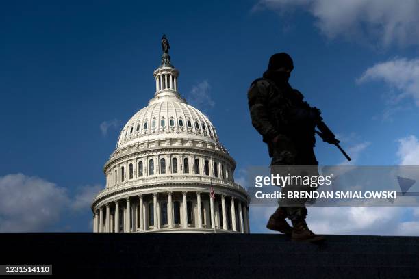 Member of the National Guard patrols the grounds of the US Capitol on March 4 in Washington, DC. Lawmakers and staff were advised to stay away from...
