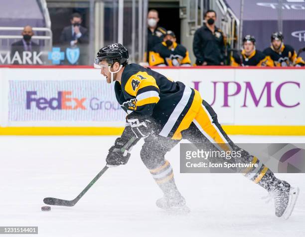 Pittsburgh Penguins right wing Josh Currie handles the puck during the second period in the NHL game between the Pittsburgh Penguins and the...