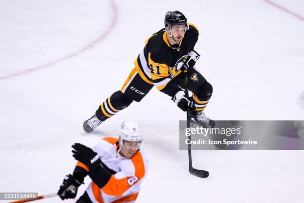 Pittsburgh Penguins right wing Josh Currie skates during the first period in the NHL game between the Pittsburgh Penguins and the Philadelphia Flyers...