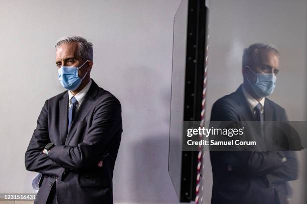 Secretary of Veterans Affairs Denis McDonough waits on the side of the stage as White House Press Secretary Jen Psaki introduces him during the daily...