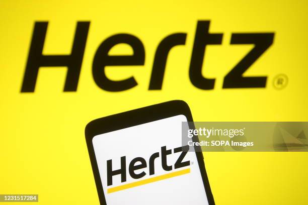 In this photo illustration the Hertz Corporation logo of a US car rental company is seen on a smartphone screen.