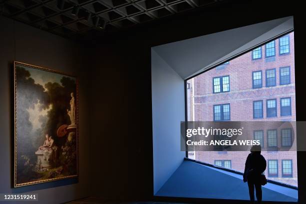 Person looks at a painting during the Frick Collection opening press preview at Frick Madison, the Marcel Breuer building, on March 4, 2021 in New...