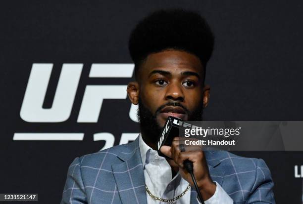 In this handout image provided by UFC, Aljamain Sterling interacts with media during the UFC 259 press conference at UFC APEX on March 04, 2021 in...