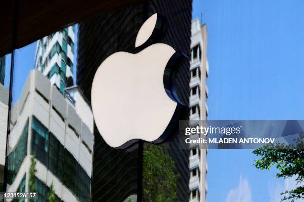 The Apple logo is seen on a window of the company's store in Bangkok on March 5, 2021.