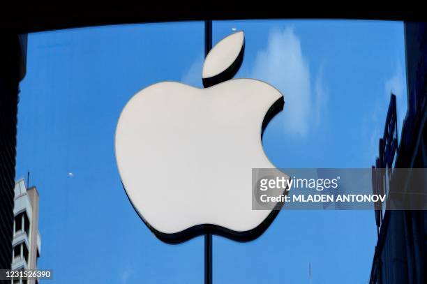 The Apple logo is seen on a window of the company's store in Bangkok on March 5, 2021.
