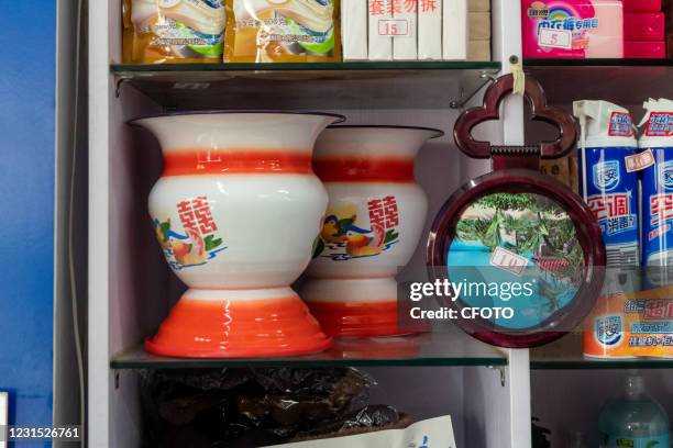 People shop for vintage Chinese goods at a Beijing department store in Jing 'an District, Shanghai, China, March 5, 2021. This shop has been at this...