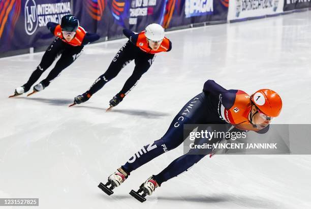 Netherland's Suzanne Schulting takes the lead over compatriot Selma Poutsma and Xandra Velzeboer as they compete in the heats for the 1500 meters...