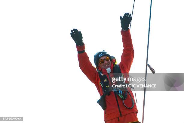 Finnish skipper Ari Huusela celebrates after crossing the finish line in 25th and last position of the Vendee Globe round-the-world solo sailing race...