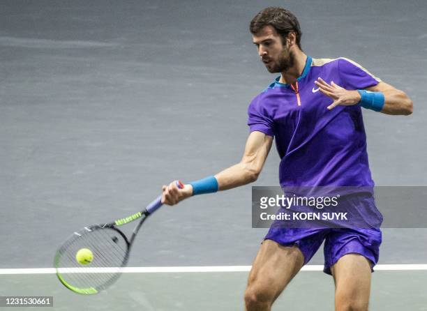 Russia's Karen Khachanov returns the ball to Greece' Stefanos Tsitsipas on the fifth day of the ABN AMRO World Tennis Tournament in Rotterdam, The...