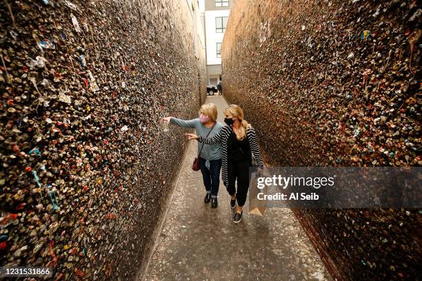 Shannon Satz, right, from Santa Barbara visits her aunt Julie Jones, a San Luis Obispo resident as they reminisce while touring Bubblegum Alley, a...