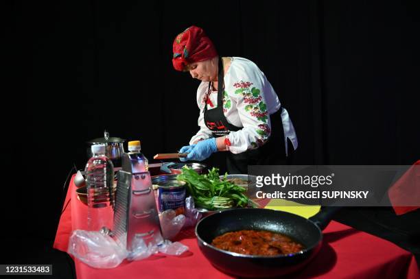 Participant cooks borscht in Kiev on March 5 during an event to promote Unesco bid to recognise the traditional beetroot and cabbage dish as part of...