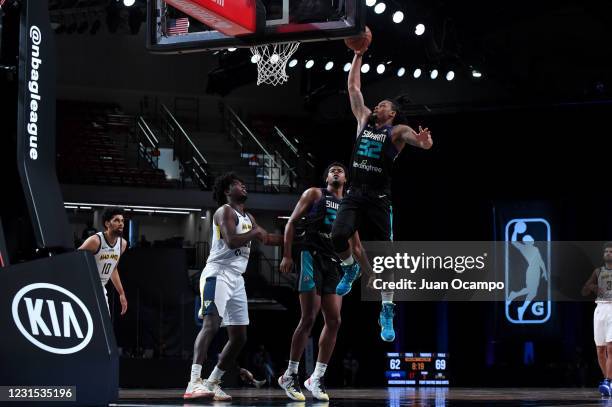 McDaniels of the Greensboro Swarm dunks the ball against the Fort Wayne Mad Ants on March 5, 2021 at AdventHealth Arena in Orlando, Florida. NOTE TO...