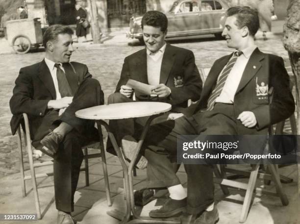 Manchester United football players, or Busby Babes, Roger Byrne , Tommy Taylor and David Pegg , relax in an unidentified European City, circa 1957....