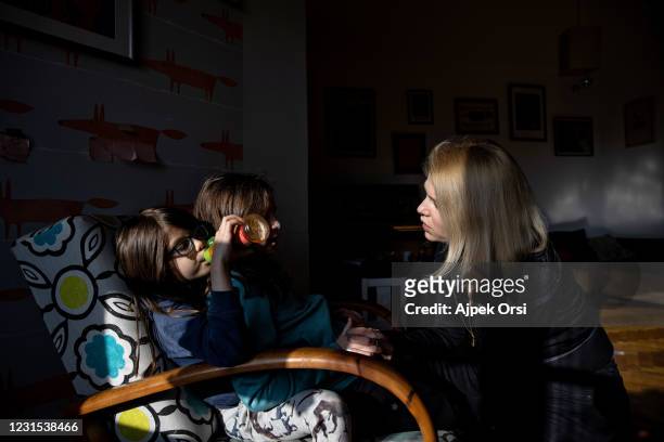 Veronika Munk, editor-in-chief of Telex, and her daughters at their home on March 5, 2021 in Budapest, Hungary. The Hungarian news site Telex was...