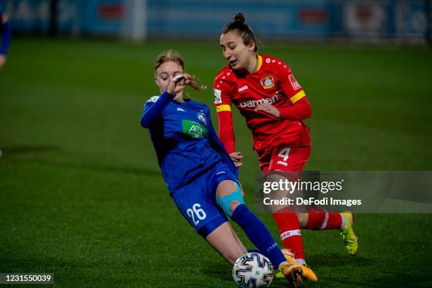 Sara Holmgaard of 1.FFC Turbine Potsdam and Sylwia Matysik of TSV Bayer 04 Leverkusen battle for the ball during the Flyeralarm Frauen Bundesliga...
