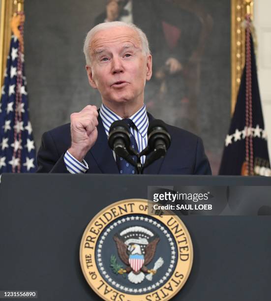 President Joe Biden speaks on the passage of the American Rescue Plan in the State Dining Room of the White House in Washington, DC, on March 6,...