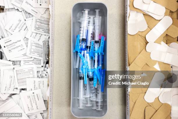 Prepared doses of the Johnson & Johnson COVID-19 vaccine, the newest vaccine approved by the U.S. FDA for emergency use, sit in a box at an event put...