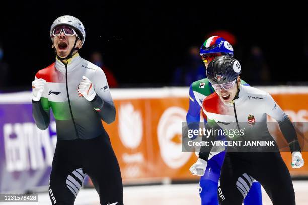 Hungary's Andor Liu Shaolin react as he crosses the finish line to win in the 1000 meters final ahead of Hungary's Shaoang Liu on the final day of...