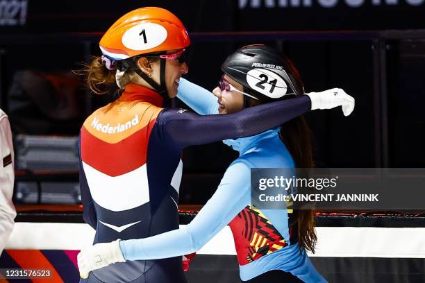 Netherlands Suzanne Schulting and Belgium's Hanne Desmet congratulate each other after Schulting won the 1000 meters final on the final day of the...