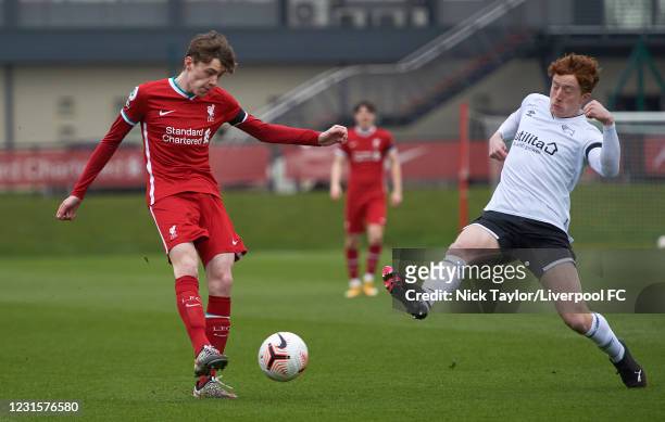 Conor Bradley of Liverpool and Connor Dixon of Derby County in action during the PL2 game at AXA Training Centre on March 7, 2021 in Kirkby, England.