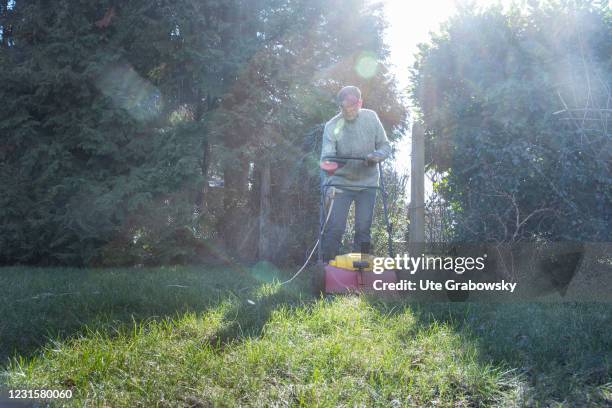 Bonn, Germany In this photo illustration a man is working in a garden on March 06, 2021 in Bonn, Germany.