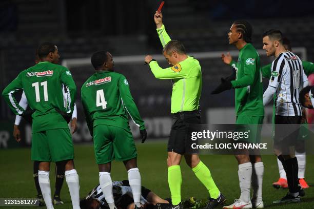 Club Franciscain's French defender Sebastien Louis Lepel is shown a red card by referee during the French Cup round-of-32 football match between...