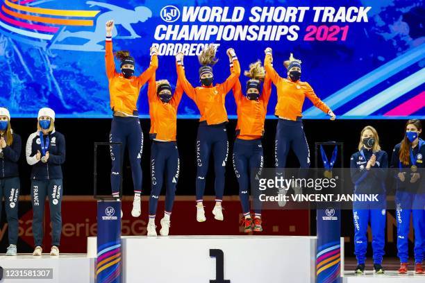 Team Netherlands celebrates gold on the podium after winning the 3000 meters women relay on the last day of the ISU World Short Track Speed Skating...