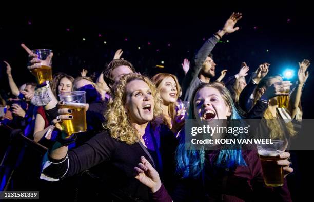 Visitors to the Ziggo Dome attend a performance by Dutch singer Andre Hazes part of a series of trial events in which Fieldlab is investigating how...