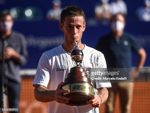 Diego Schwartzman of Argentina poses with the champions trophy after winning a Men's Singles Final match against Francisco Cerundolo of Argentina as...