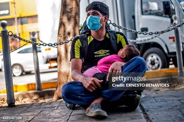 Venezuelan Alexander Mejias a beggar, poses for a photo after an interview with AFP in Lima on March 02, 2021. - Two out of three Venezuelan migrants...