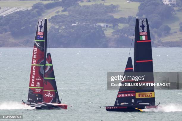 This picture taken on March 6, 2021 shows Emirates Team New Zealand and Luna Rossa Prada Pirelli sailing during a free training session ahead of the...