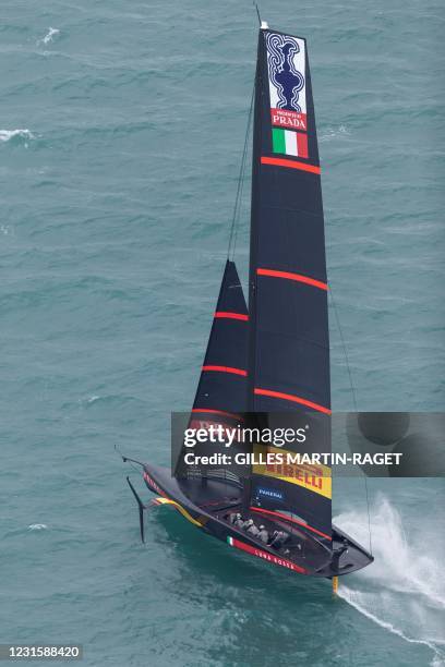 This picture taken on December 11, 2020 shows the Luna Rossa Prada Pirelli sailing during a training session in Auckland. - Team New Zealand and Luna...