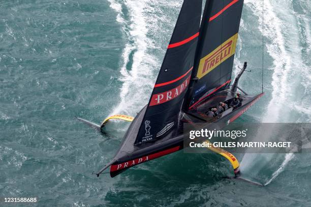 This picture taken on December 11, 2020 shows the Luna Rossa Prada Pirelli sailing during a training session in Auckland. - Team New Zealand and Luna...