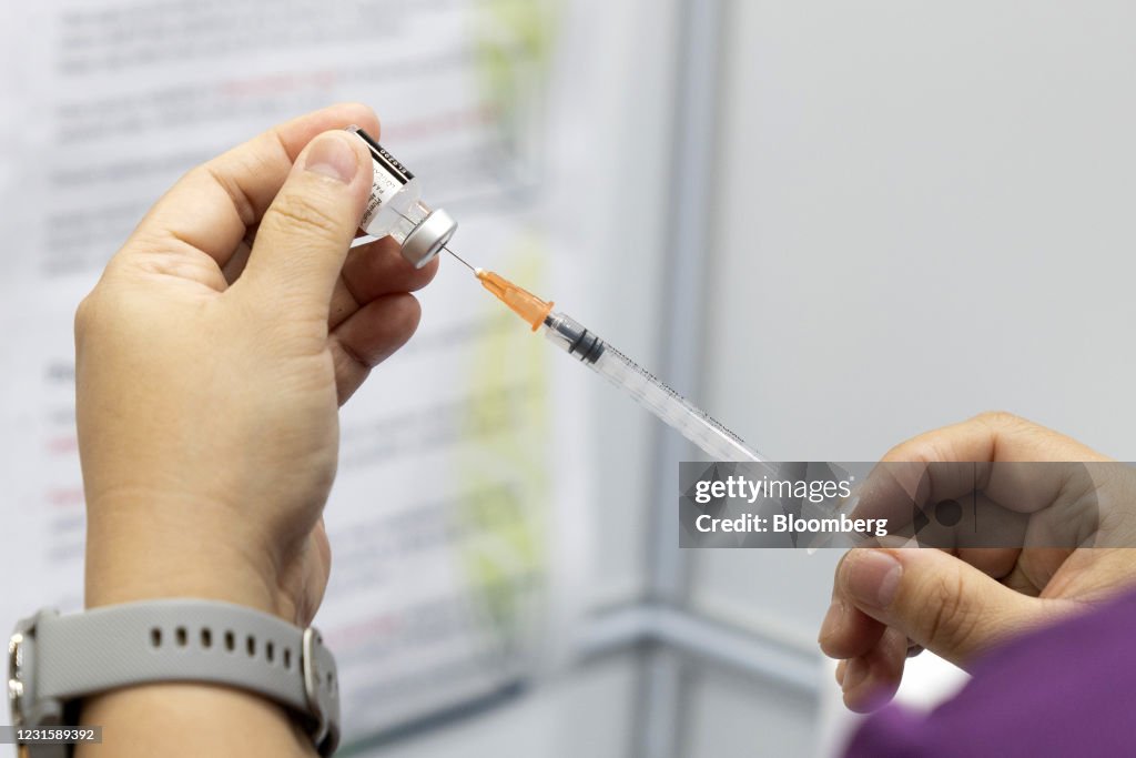 Inoculating Seniors at a Vaccination Center as Singapore is Prioritizing Safely Reopening Its Borders