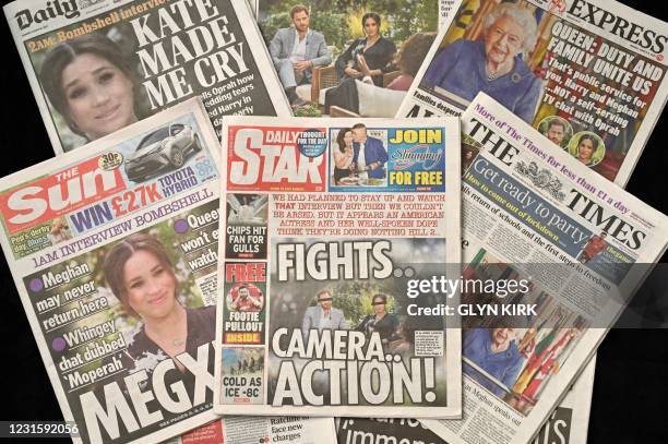 An arrangement of UK daily newspapers photographed as an illustration in Brighton on March 8 shows front page headlines reporting on the story of the...