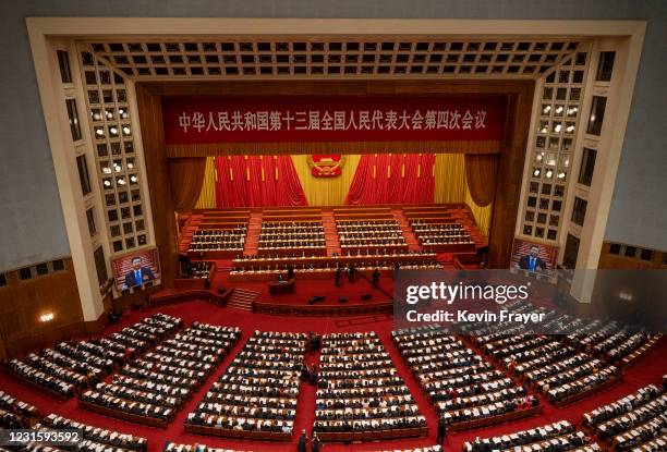 Chinese President Xi Jinping, center, and lawmakers gather at the second plenary session of the National People's Congress at the Great Hall of the...