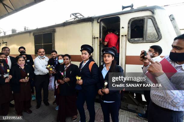 Railway officials bring flowers to female Loco pilots before leaving at Allahabad Junction on March 8 on International Women's Day.